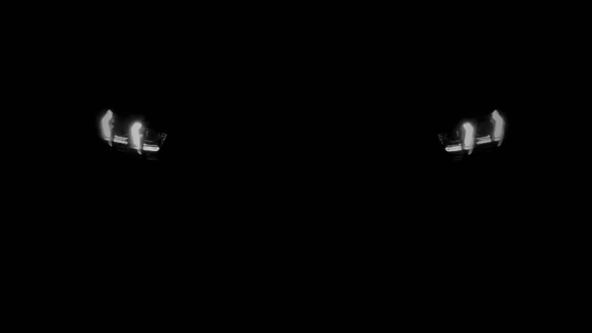 Headlights of the OSPIPO sedan lit in the dark
